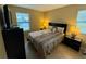 Comfortable bedroom with double bed, dresser and window at 3001 58Th S Ave # 701, St Petersburg, FL 33712