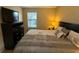 Spacious bedroom with king-size bed, dresser, and window at 3001 58Th S Ave # 701, St Petersburg, FL 33712