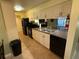 Modern kitchen with white cabinets and appliances at 3001 58Th S Ave # 701, St Petersburg, FL 33712