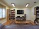 Common area library with bookshelves, a TV, and ample seating at 3001 58Th S Ave # 701, St Petersburg, FL 33712