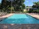 Community pool with lounge chairs at 3001 58Th S Ave # 701, St Petersburg, FL 33712