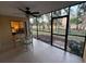 Relaxing screened patio with glass top table and view of backyard at 3001 58Th S Ave # 701, St Petersburg, FL 33712