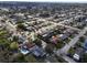 Aerial view of a single Gathering home in a residential area at 3435 Roxbury Dr, Holiday, FL 34691