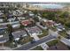 Aerial view of a house in a residential neighborhood near the water at 3435 Roxbury Dr, Holiday, FL 34691