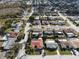 An aerial view of a home with a pool in a residential neighborhood at 3435 Roxbury Dr, Holiday, FL 34691