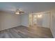 Bedroom with ceiling fan and wood-look flooring at 3435 Roxbury Dr, Holiday, FL 34691