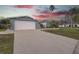 Attached garage with driveway at 3435 Roxbury Dr, Holiday, FL 34691