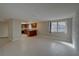 Spacious living room with tile flooring and stone accent wall at 3435 Roxbury Dr, Holiday, FL 34691