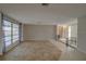 Open living space with tile floors and sliding doors at 3435 Roxbury Dr, Holiday, FL 34691