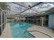 Inviting swimming pool with safety fence at 3435 Roxbury Dr, Holiday, FL 34691