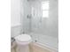 Modern bathroom with marble shower and toilet at 3630 E North Bay St, Tampa, FL 33610