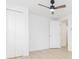 Bright bedroom with ceiling fan, closet and door at 3630 E North Bay St, Tampa, FL 33610