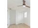 Well-lit bedroom featuring a ceiling fan and closet at 3630 E North Bay St, Tampa, FL 33610