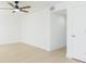 Bright bedroom with ceiling fan, light flooring and doors at 3630 E North Bay St, Tampa, FL 33610