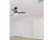 Bright bedroom with ceiling fan, closet, and door at 3630 E North Bay St, Tampa, FL 33610