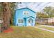 Newly constructed light blue house with a walkway and landscaping at 3630 E North Bay St, Tampa, FL 33610