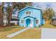 Newly built light blue house with a walkway and small yard at 3630 E North Bay St, Tampa, FL 33610