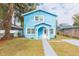 Newly built light blue house with a walkway and small yard at 3630 E North Bay St, Tampa, FL 33610