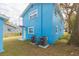 Side view of light blue house with two AC units at 3630 E North Bay St, Tampa, FL 33610