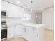 Modern kitchen with island and white cabinets at 3630 E North Bay St, Tampa, FL 33610