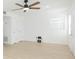 Spacious living room with ceiling fan and light flooring at 3630 E North Bay St, Tampa, FL 33610