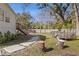 Backyard with stone pathway, wooden steps and a trailer at 3752 Elfers Pkwy, New Port Richey, FL 34655