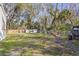 Spacious backyard with wooden fence and trees at 3752 Elfers Pkwy, New Port Richey, FL 34655