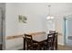 Dining room with brick accent wall and wood table at 3752 Elfers Pkwy, New Port Richey, FL 34655