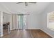 Living room featuring sliding glass doors and laminate floors at 3752 Elfers Pkwy, New Port Richey, FL 34655