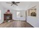 Living room with fireplace, laminate wood floors, and kitchen view at 3752 Elfers Pkwy, New Port Richey, FL 34655