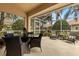 Relaxing screened patio with seating area, perfect for outdoor dining at 3838 Muirfield Ct, Palm Harbor, FL 34685