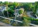 Aerial view of a charming house with a walkway, landscaping, and palm trees at 4056 18Th S Ave, St Petersburg, FL 33711