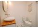 Simple bathroom with white toilet and wood vanity top at 4056 18Th S Ave, St Petersburg, FL 33711