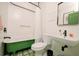 Charming bathroom with green clawfoot tub and patterned tile at 4056 18Th S Ave, St Petersburg, FL 33711