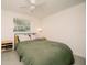 Bedroom with green bedding and ceiling fan at 4056 18Th S Ave, St Petersburg, FL 33711