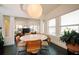 Bright dining room with round table and modern chairs, open to living area at 4056 18Th S Ave, St Petersburg, FL 33711