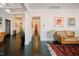 Long hallway with dark tile floors and artwork on the walls at 4056 18Th S Ave, St Petersburg, FL 33711