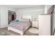 Bedroom with floral bedding, white dresser, and a closet at 4154 Pinelake Ln # 101, Tampa, FL 33618