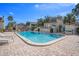 Community pool with lounge chairs and surrounding patio at 4154 Pinelake Ln # 101, Tampa, FL 33618