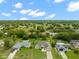 Aerial view of neighborhood with a tan house and surrounding homes at 4522 Gondolier Rd, Spring Hill, FL 34609