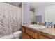 Clean bathroom with shower/tub combo and light wood vanity at 4522 Gondolier Rd, Spring Hill, FL 34609