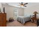 Comfortable bedroom with a double bed, window, and neutral decor at 4522 Gondolier Rd, Spring Hill, FL 34609