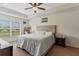 King sized bed in main bedroom with large window at 4522 Gondolier Rd, Spring Hill, FL 34609