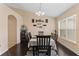 Bright dining room with table and chairs, hardwood floors, and decorative wall art at 4522 Gondolier Rd, Spring Hill, FL 34609