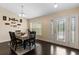 Inviting entryway with a charming glass door and hardwood floors at 4522 Gondolier Rd, Spring Hill, FL 34609