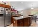 Well-equipped kitchen with island, stainless steel appliances, and wood cabinets at 4522 Gondolier Rd, Spring Hill, FL 34609