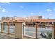 Balcony view overlooking a vibrant streetscape with shops and restaurants at 470 Mandalay Ave # 306, Clearwater Beach, FL 33767