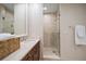 Bathroom with a double vanity and walk in shower at 470 Mandalay Ave # 306, Clearwater Beach, FL 33767