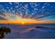 Stunning sunset view over the beach with beautiful clouds and calm water at 470 Mandalay Ave # 306, Clearwater Beach, FL 33767