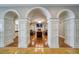 Elegant hallway with arched entryways leading to lounge at 470 Mandalay Ave # 306, Clearwater Beach, FL 33767